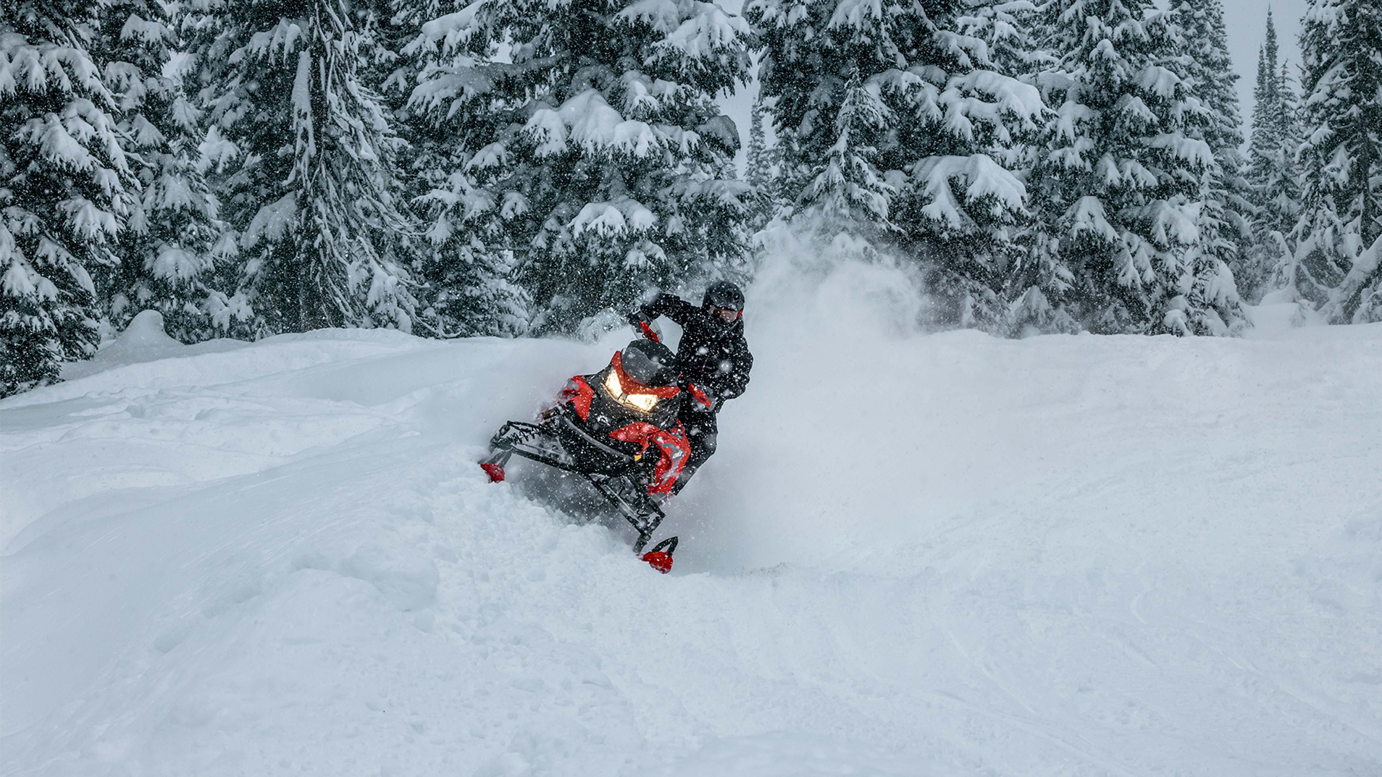 Lynx Rave RE snowmobile riding on snowy trail