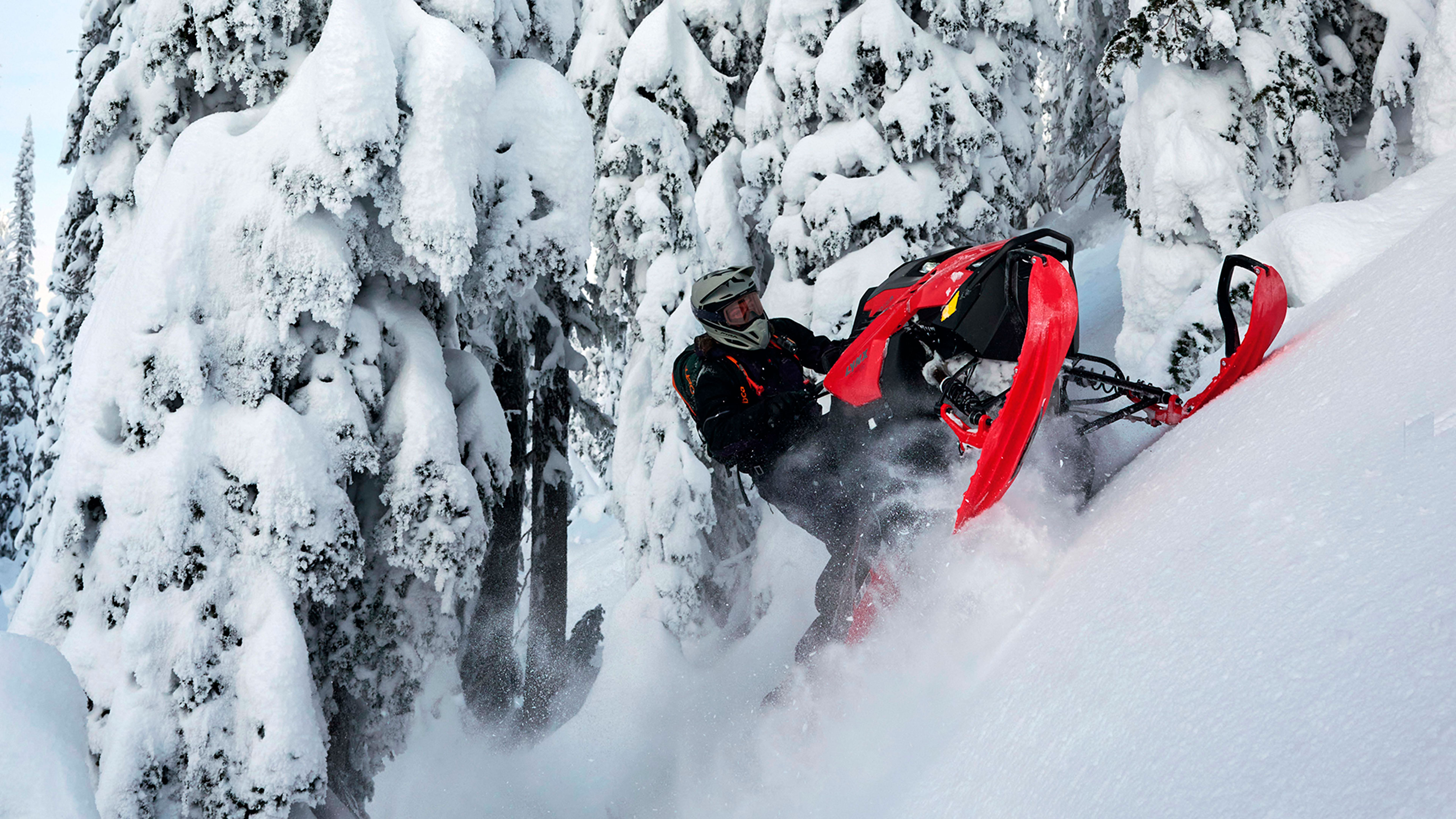 Lynx Shredder DS snowmobile climbing steep hill