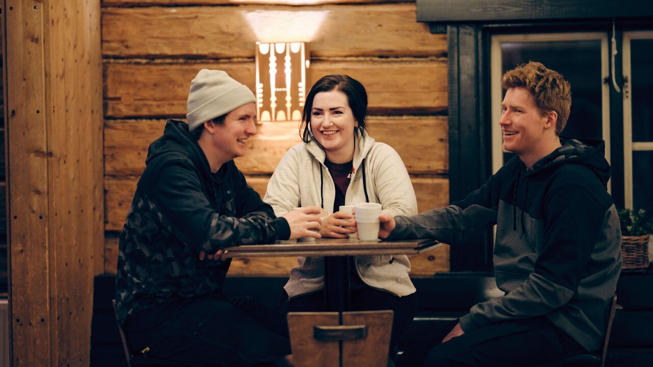 Two men and woman with Lynx hoodies