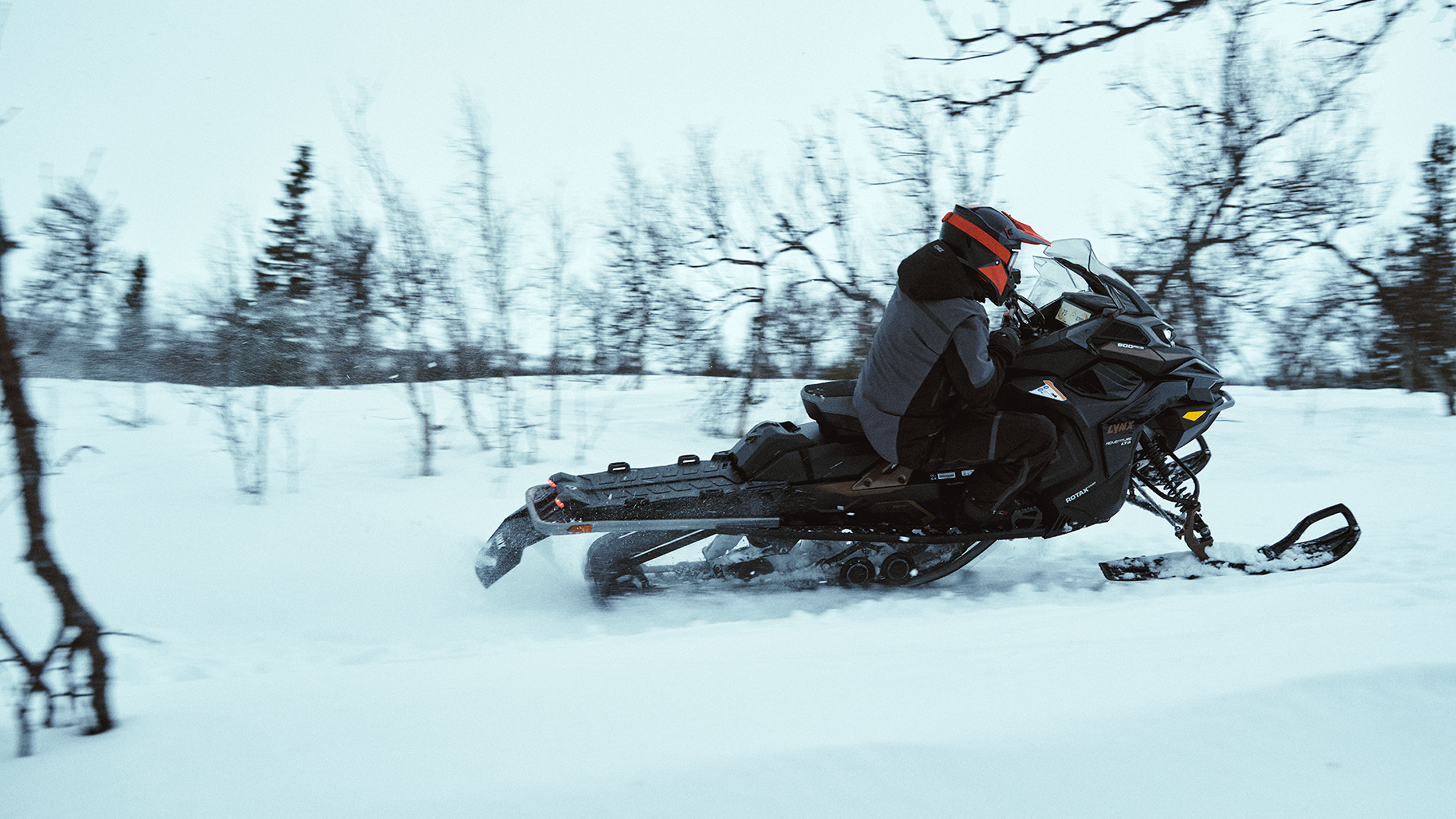 Lynx Adventure Limited 2025 snowmobile cornering fast on trail