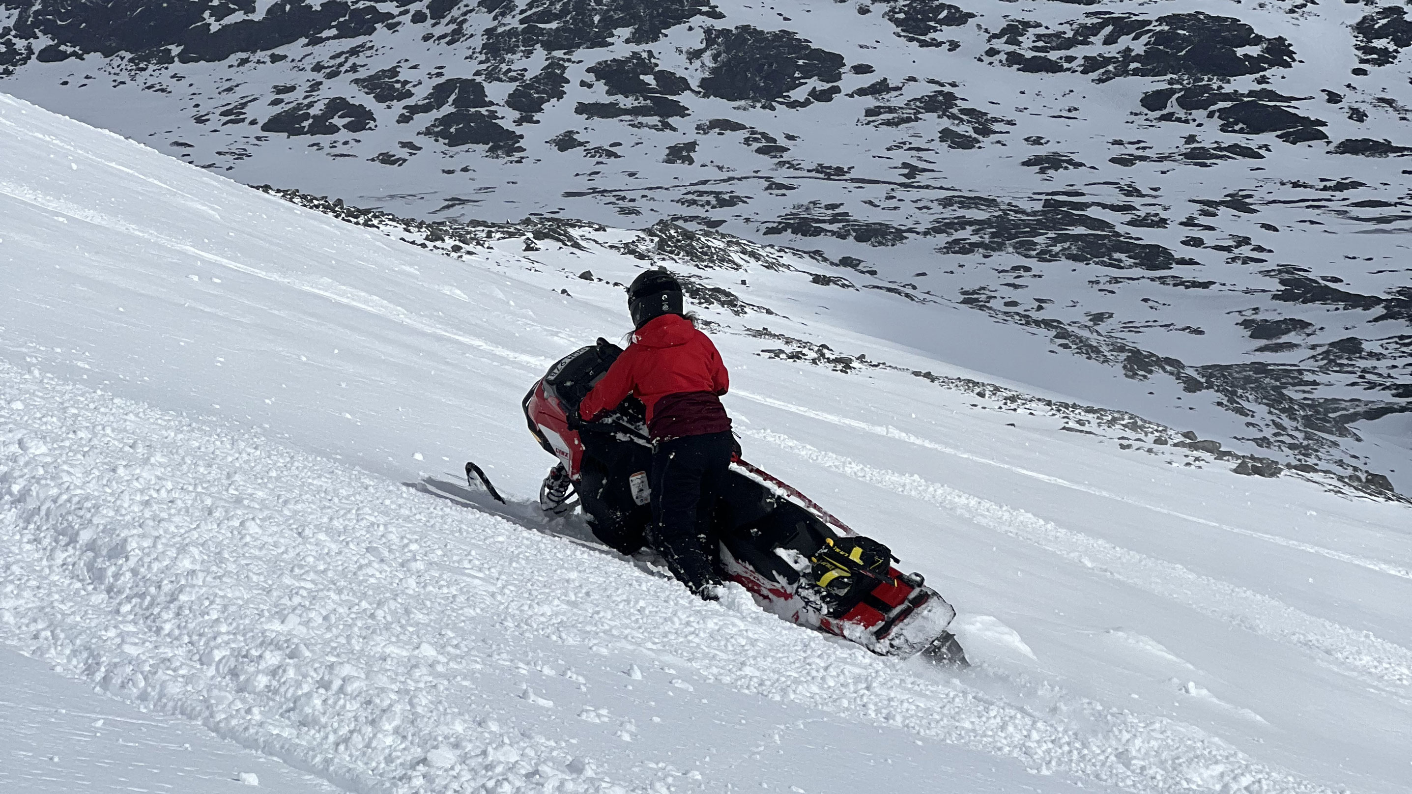 Mariell Kvickström riding a Lynx snowmobile in Riksgränsen