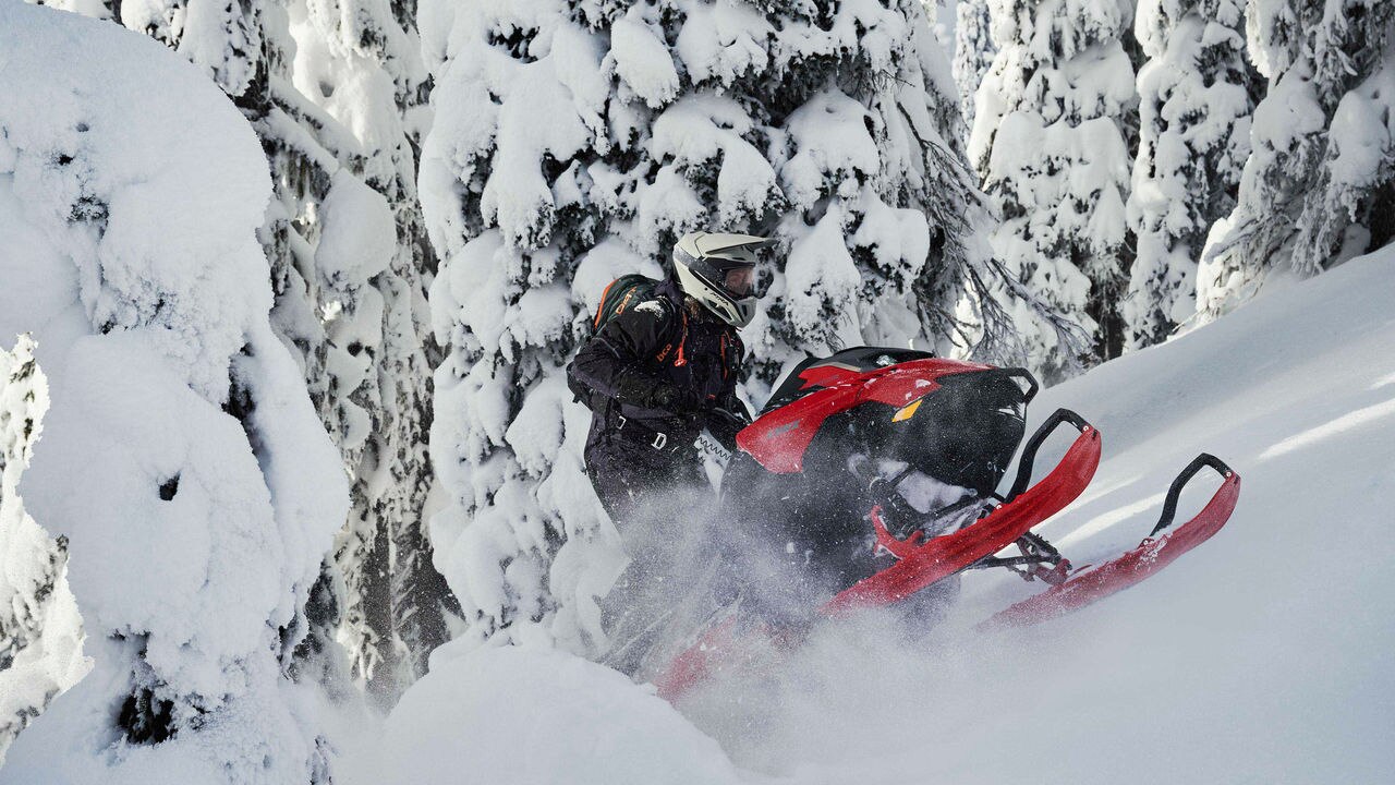 Man going up a hill with a Lynx Shredder