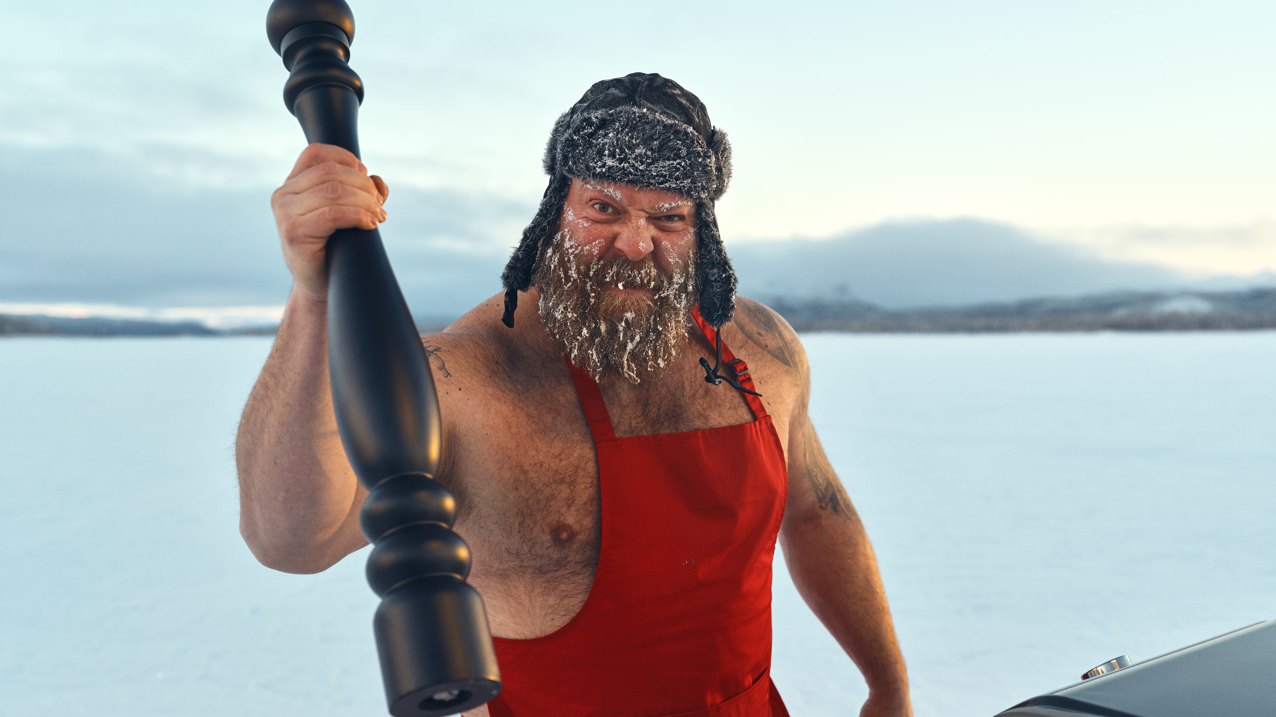 Man holding a huge pepper shaker