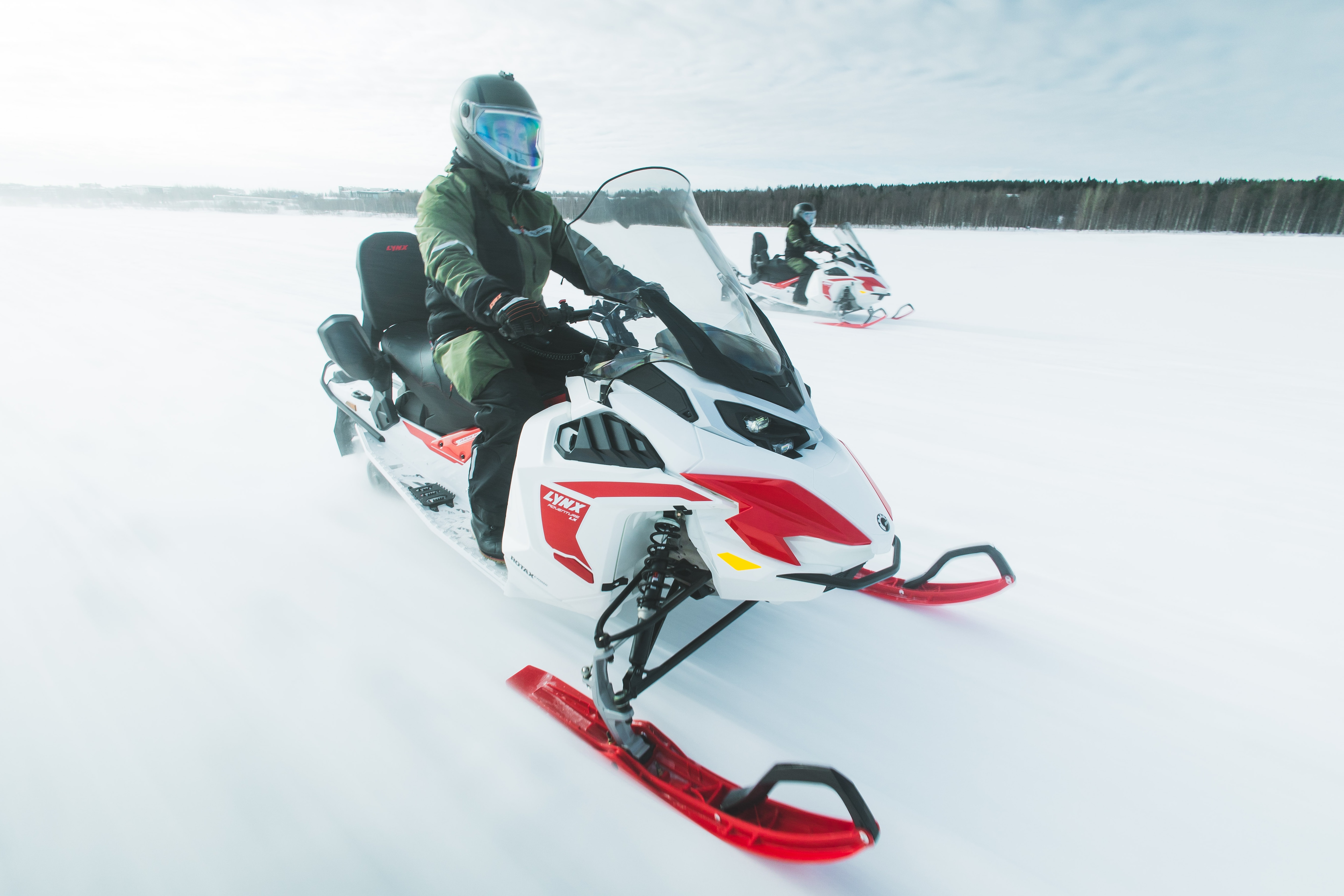 Two riders riding Lynx Adventrure Electric on ice