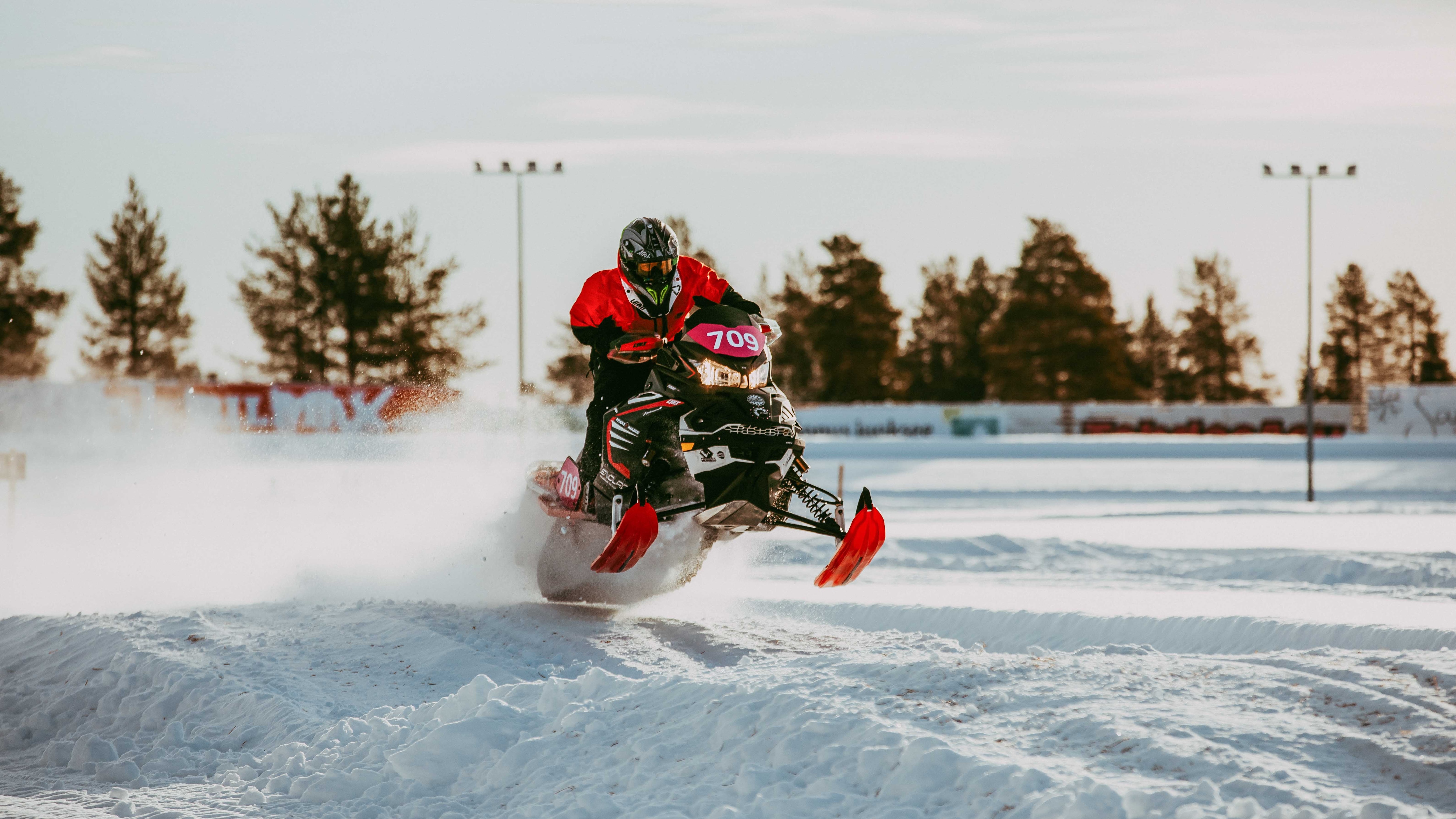 Lynx Rave Enduro snowmobile riding on race track