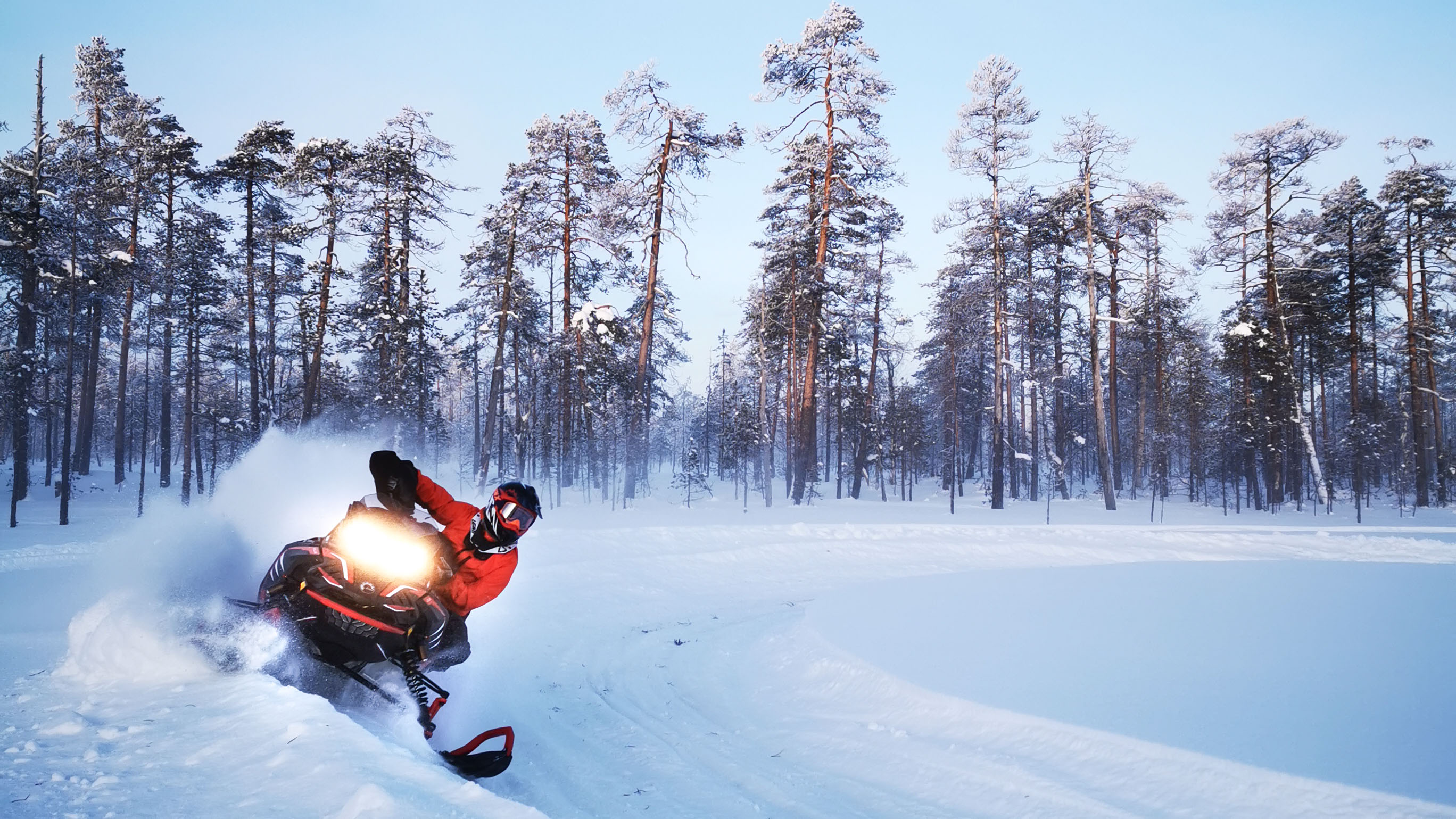 Lynx Rave Enduro snowmobile riding on trail