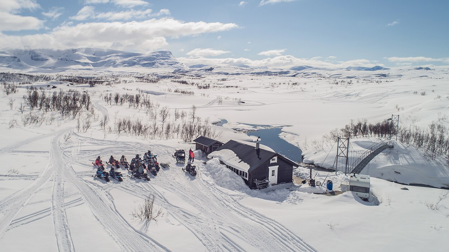 Lynx snowmobiles parked at camp in Riksgränsen.