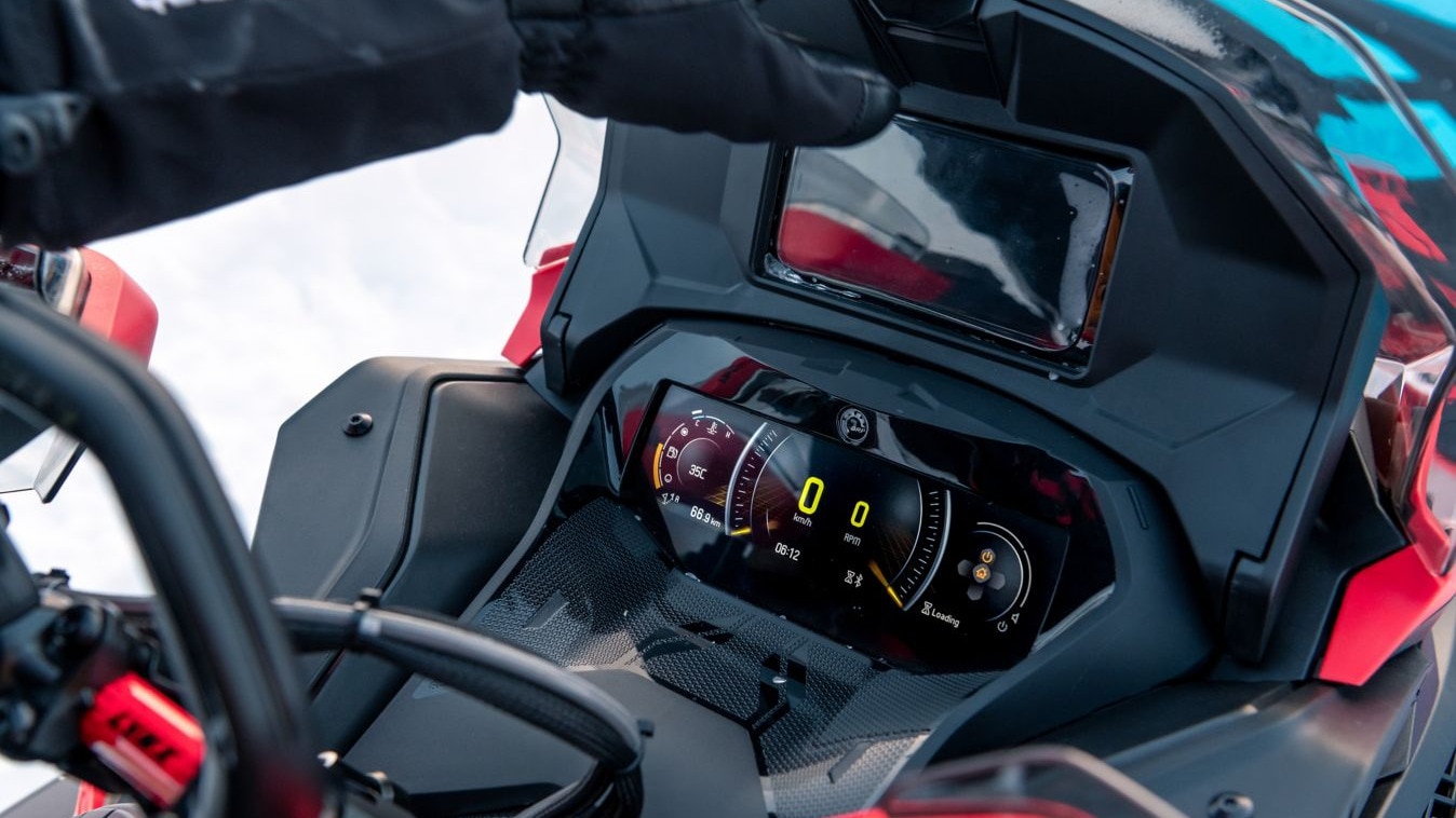 The 7.8" display and cell phone holder accessory on a Lynx snowmobile