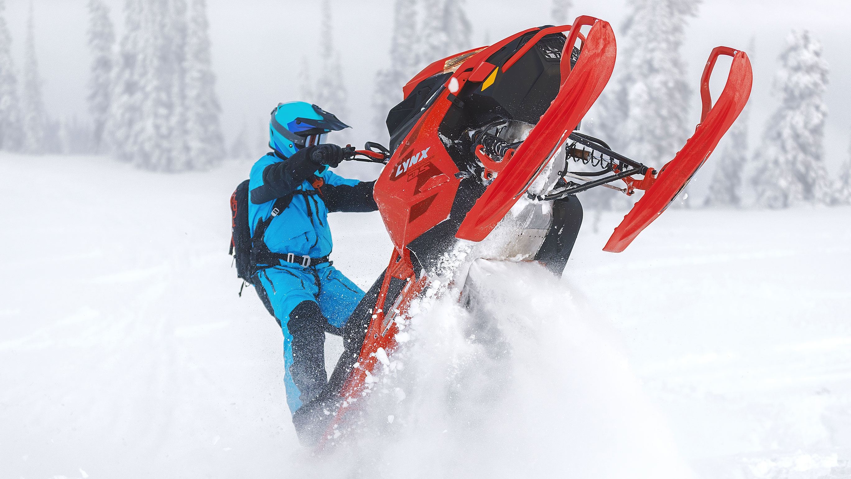 Man snowmobiling in candle with his 2022 Lynx BoonDocker