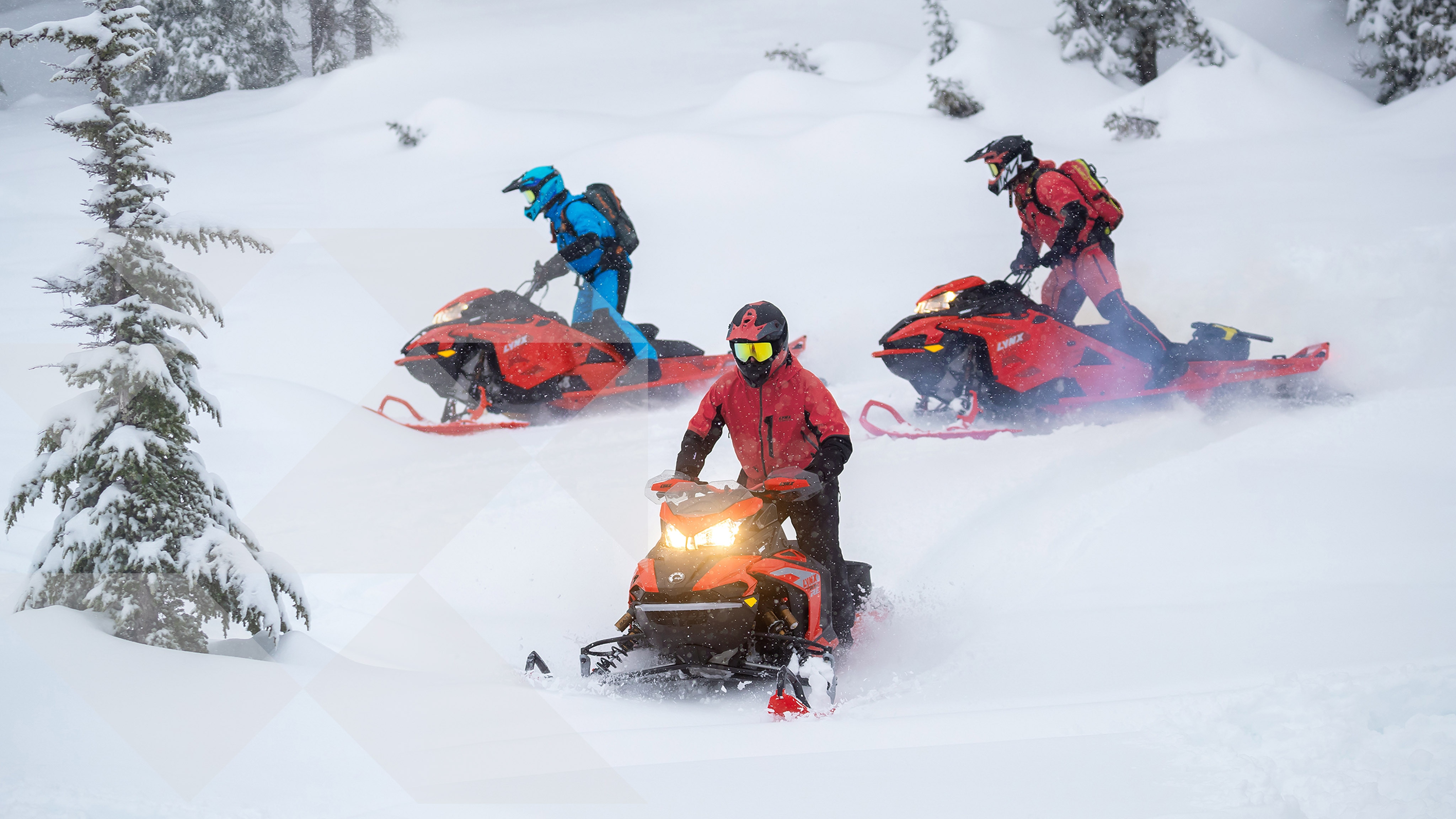 3 mens riding Lynx Snowmobiles