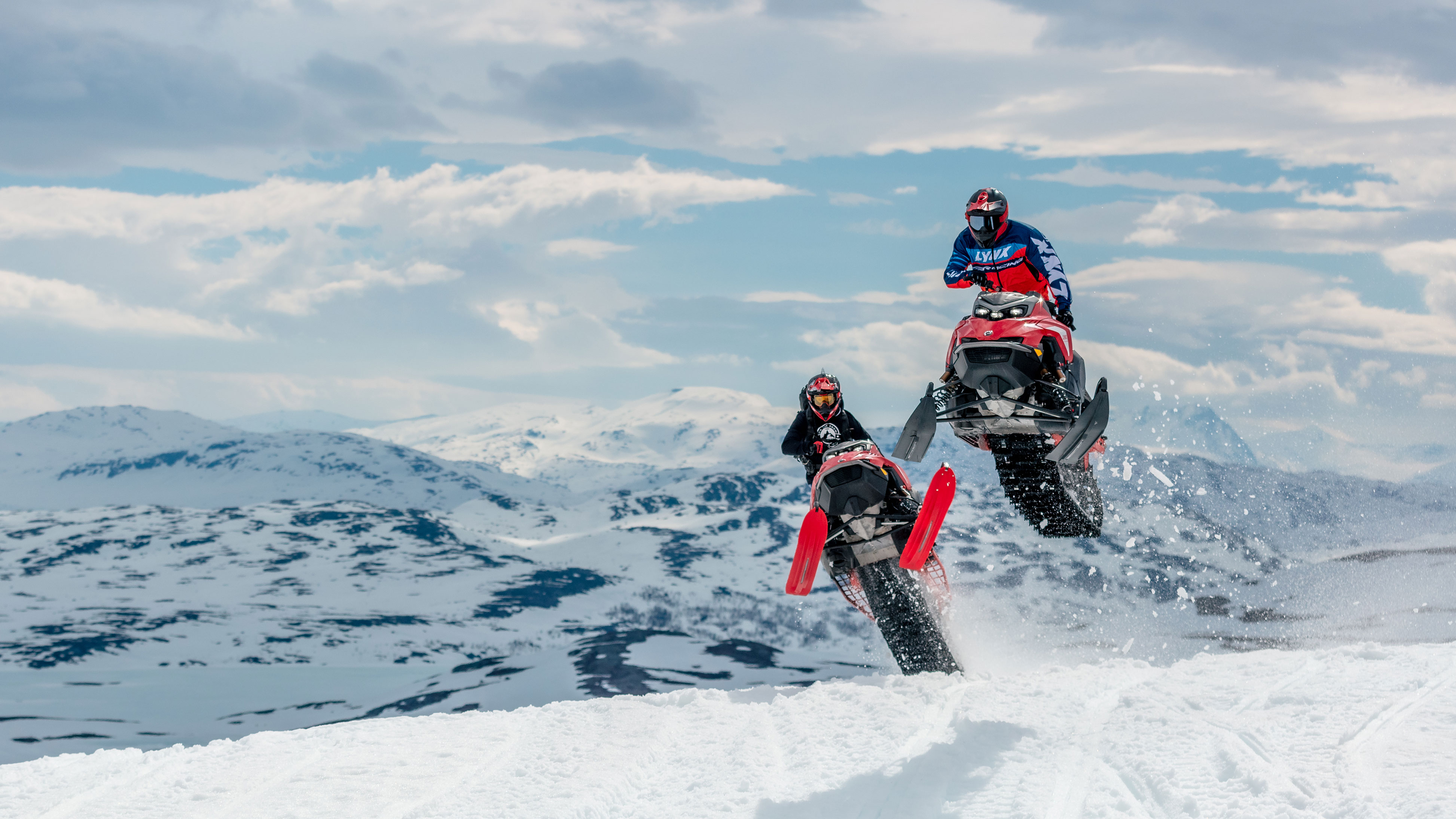 Two riders in Scandinavia with their Lynx snowmobiles