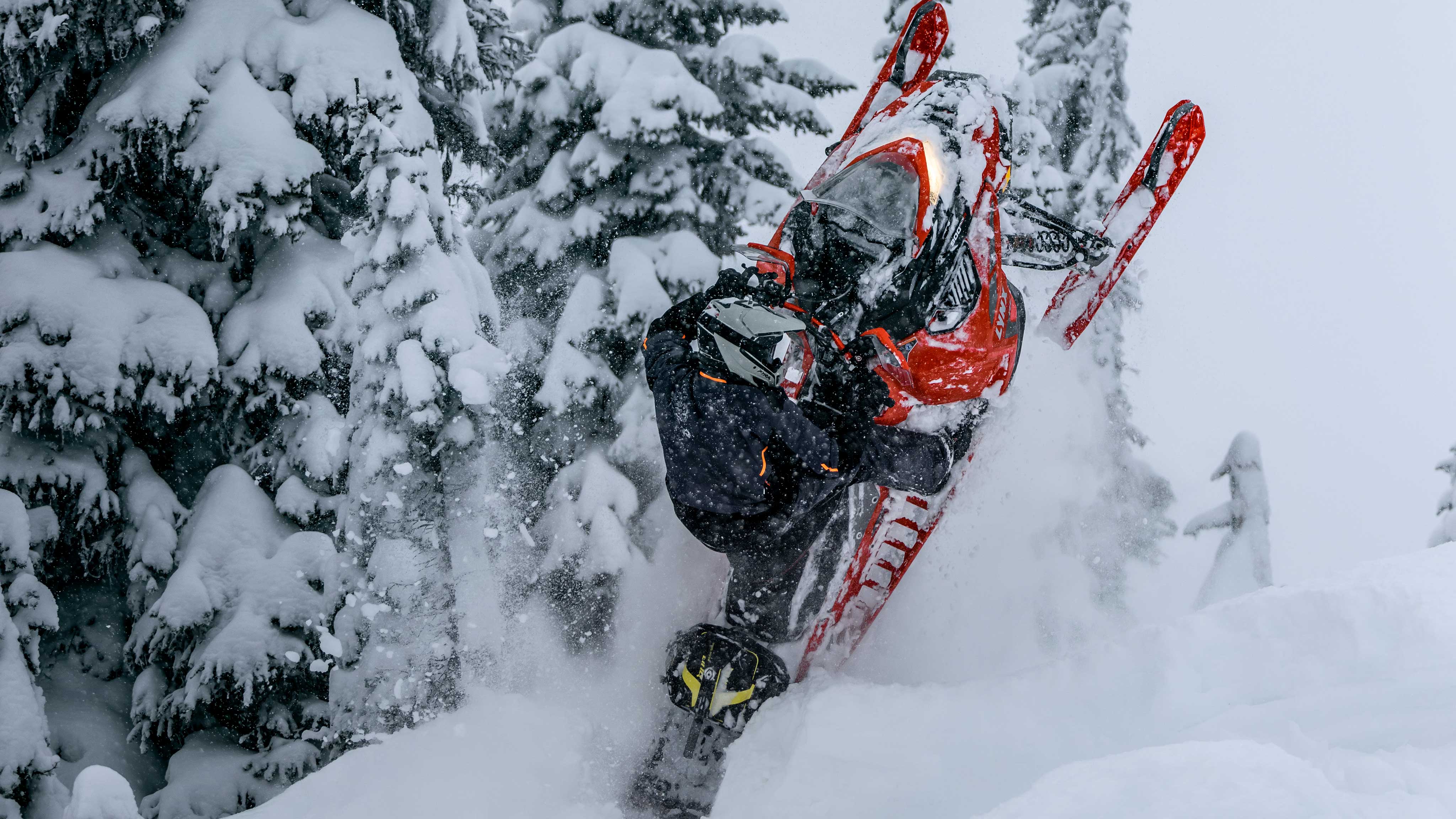 Rider pulling off an air trick on their 2023 Lynx snowmobile