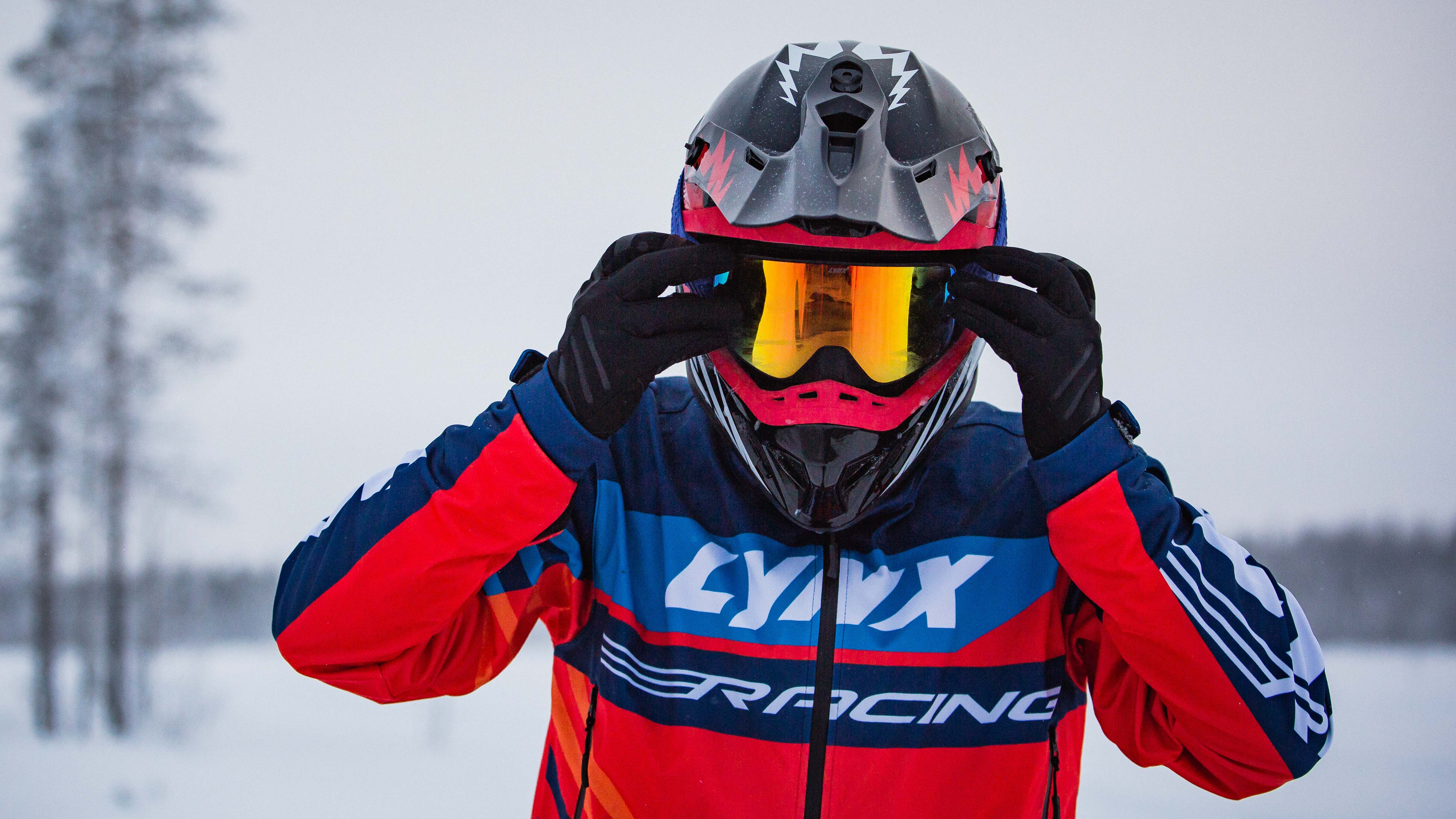 Lynx Racing rider putting goggles on