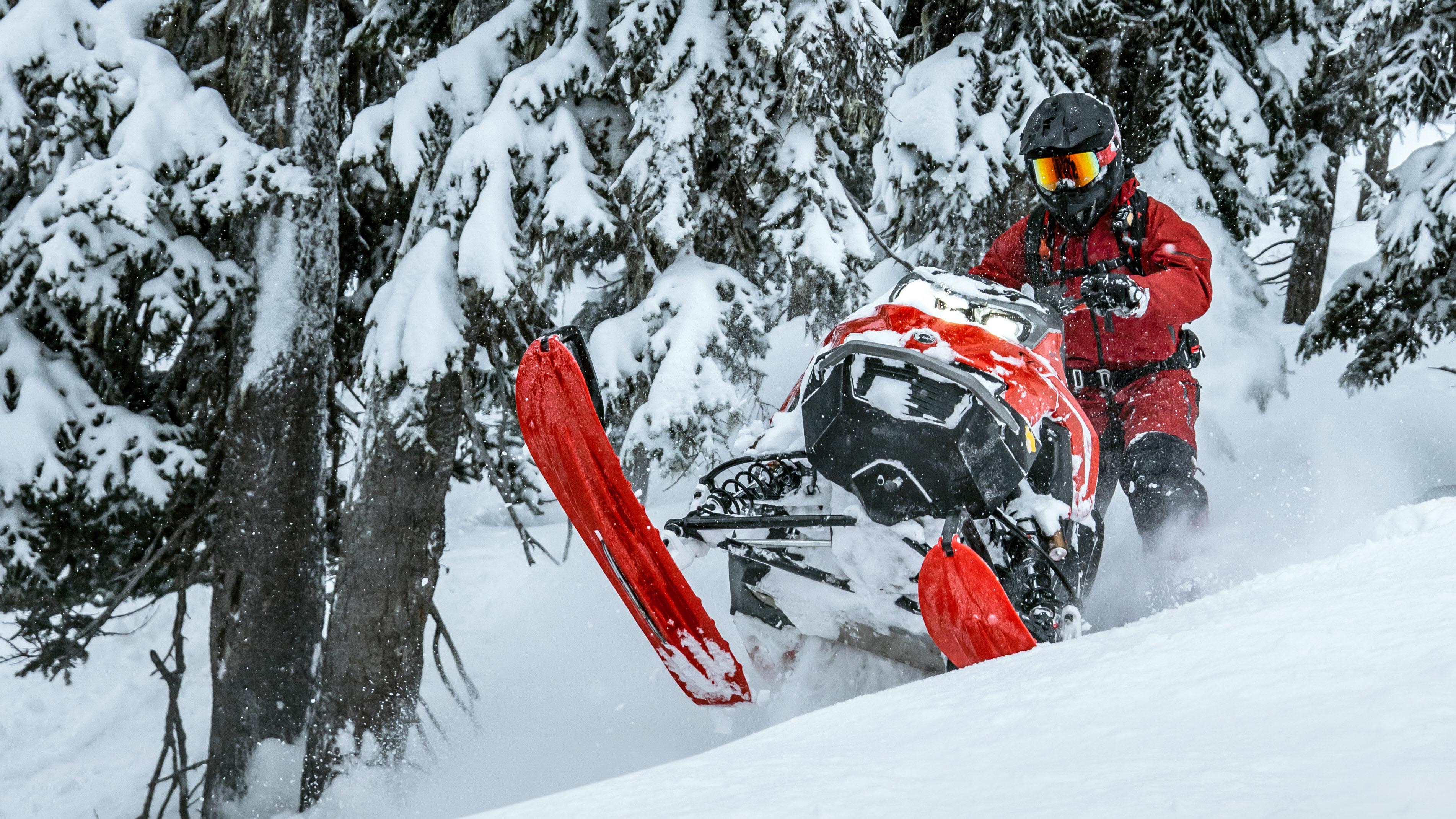 Lynx Quantum geared rider riding in deep snow wih Shredder