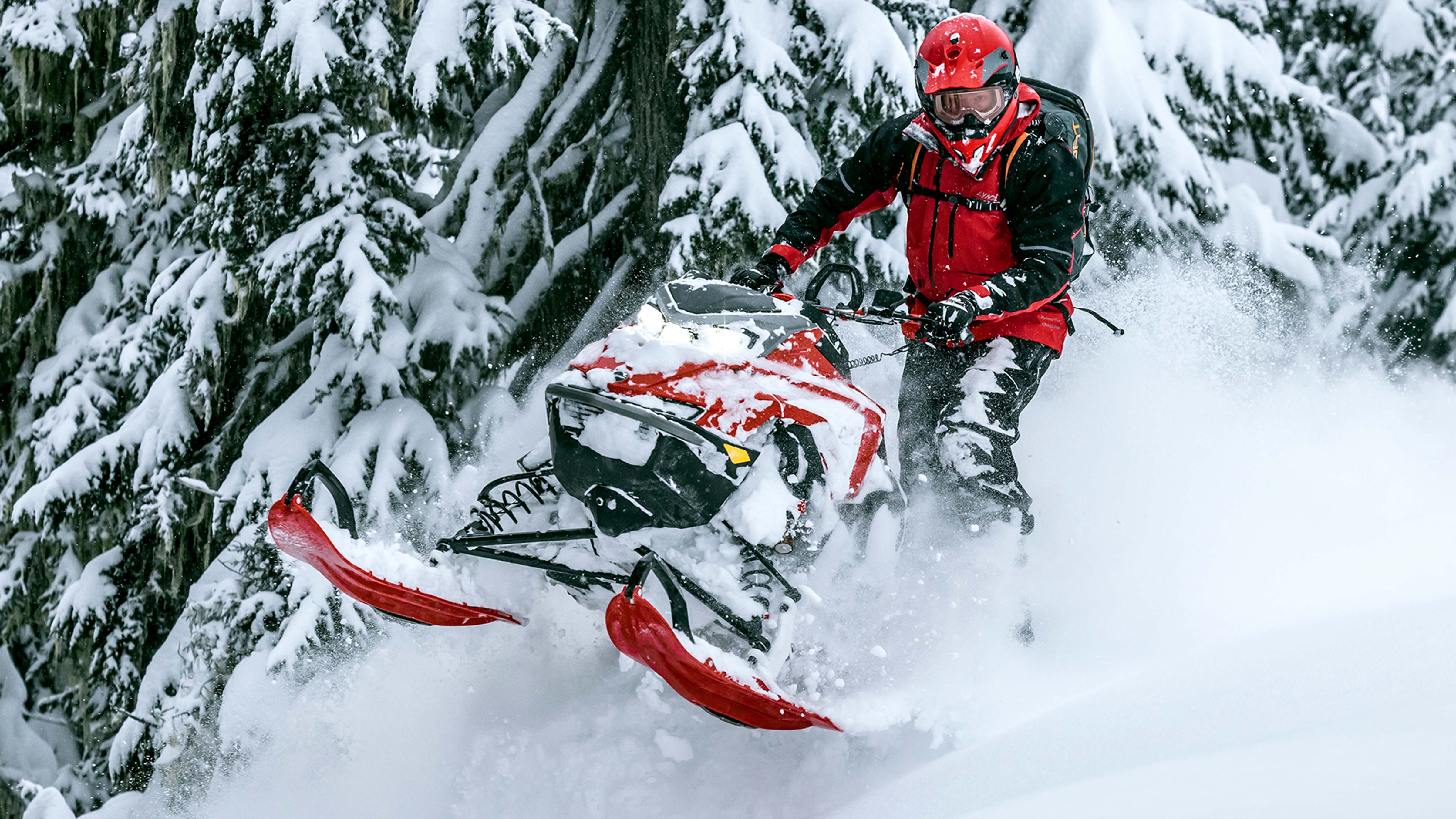 Lynx Shredder snowmobile riding in deep snow