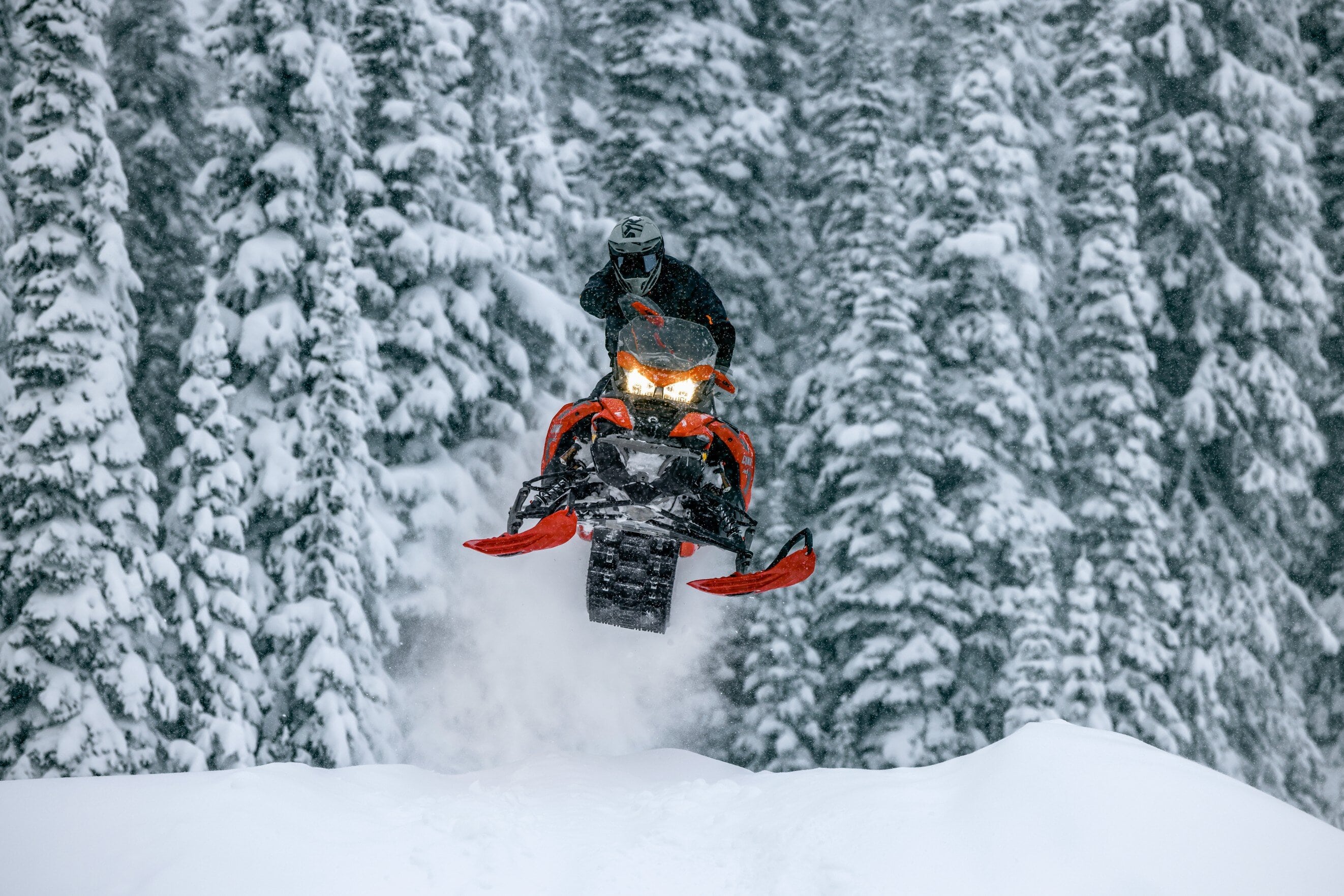 Snowmobile rider jumping with his Lynx Xterrain RE