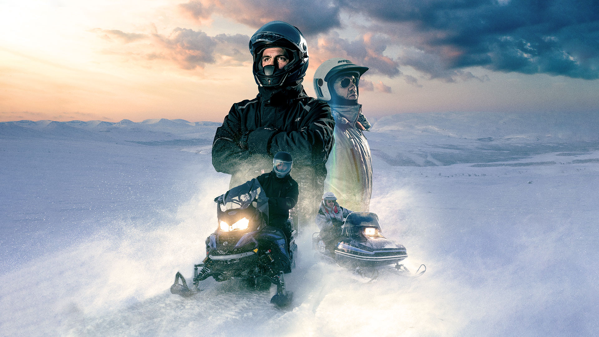 Three men celebrating their success in snowcross race with Lynx GLS 3300 snowmobiles