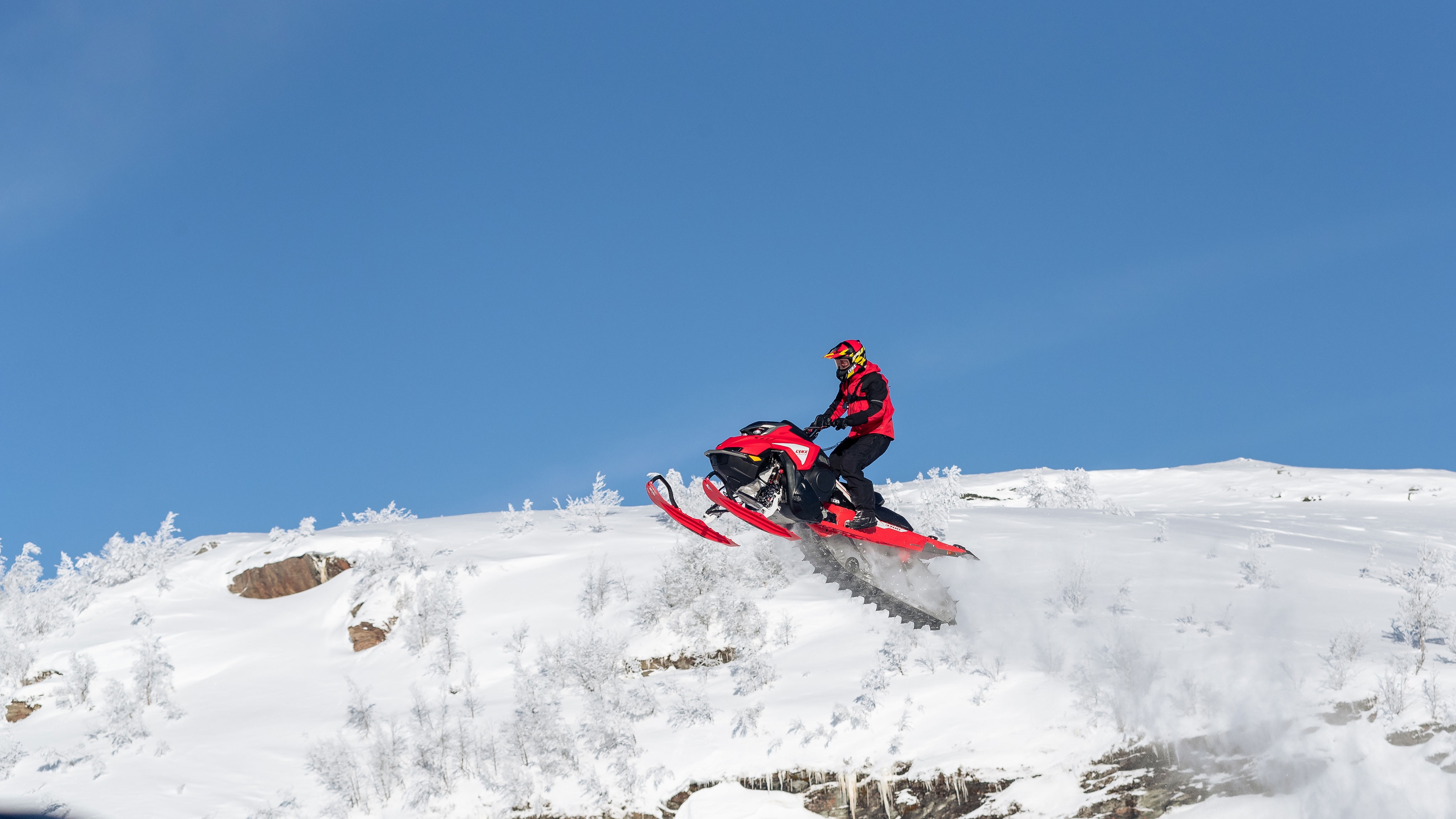 Andreas Bergmark jumping with his Lynx snowmobile