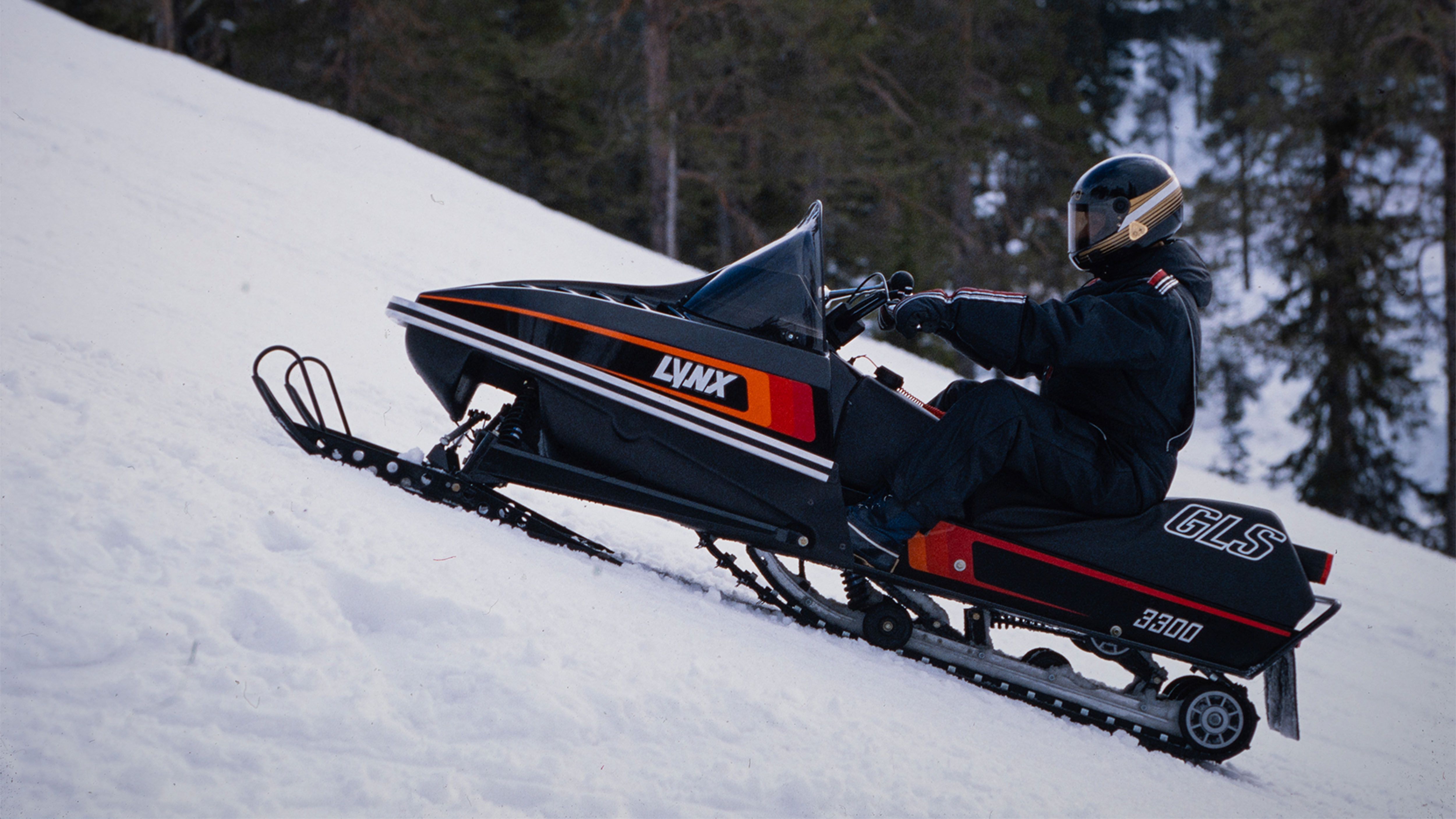 Lynx 3300 sport snowmobile parked on a slope