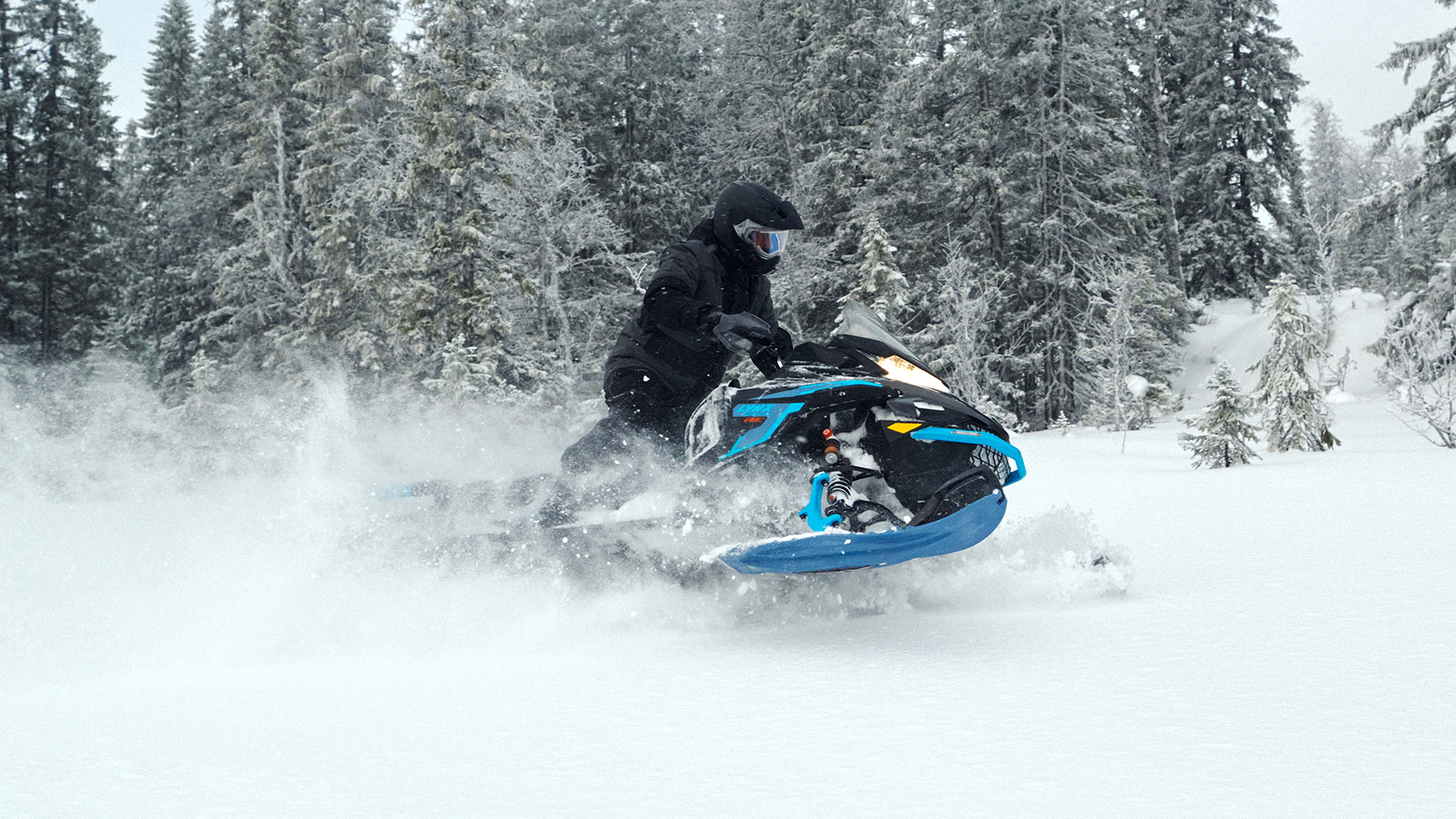 Lynx Commander RE snowmobile riding in deep snow