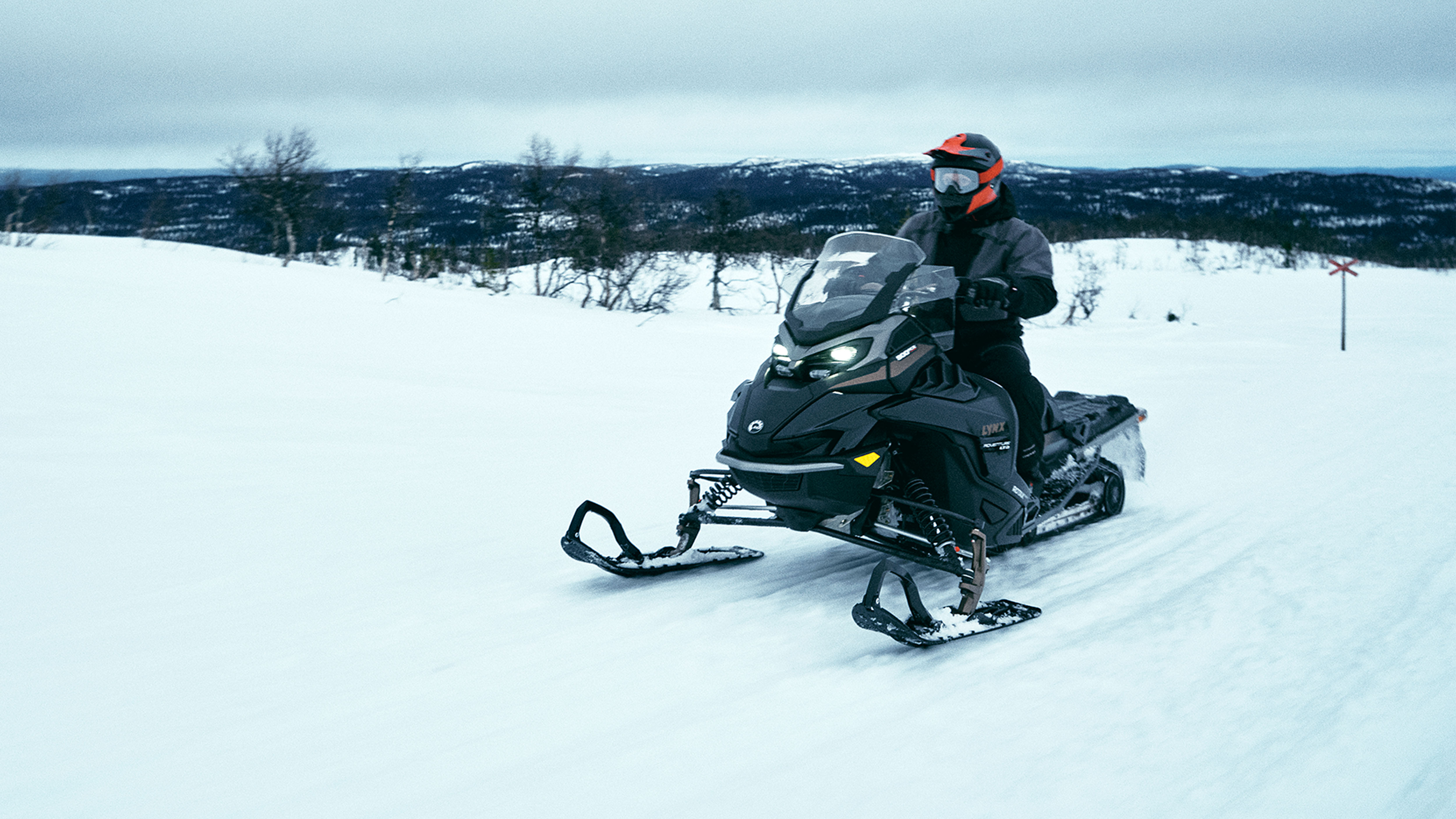 Lynx Adventure Limited 2025 snowmobile riding on trail 